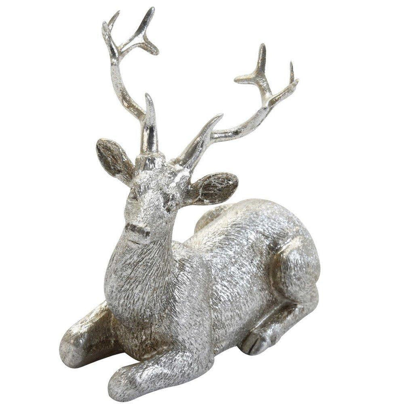 Figurka dekoracyjna, motyw leżącego renifera, kolor srebrny, 10 cm